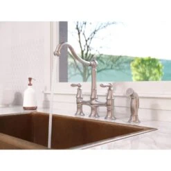 Courant Two Handle Bridge Kitchen Faucet With Side Spray In Stainless Steel -Valpar Bathroom Shop 52bc5f7b81e381246de5c92b9e39d6f9 1800x1800